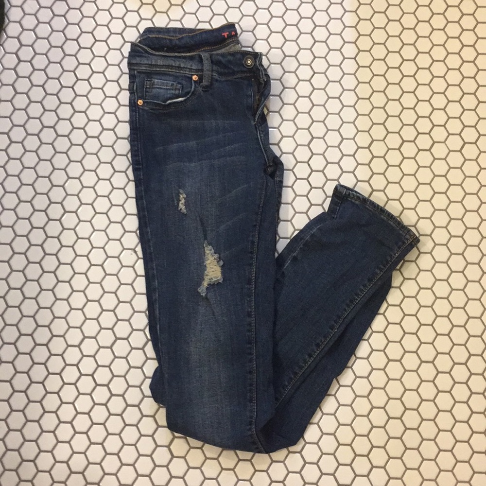 Medium to dark wash jeans with small rips mid rise